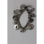 A LARGE HALLMARKED SILVER CHARM BRACELET APPROX WEIGHT 59.7G