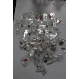 A LARGE QUANTITY OF PACKAGED SILVER CHARMS (50)