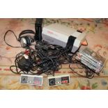 A NES NINTENDO ENTERTAINMENT SYSTEM, TOGETHER WITH A NINTENDO WII CONSOLE ETC., UNTESTED