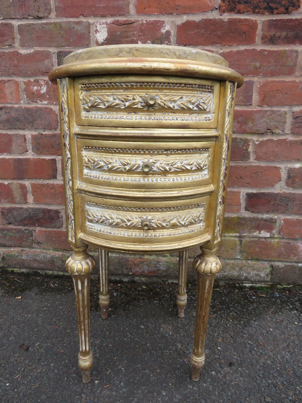 A FRENCH STYLE GILT WOOD AND MARBLE TOPPED THREE DRAWER CIRCULAR CHEST H-70 CM