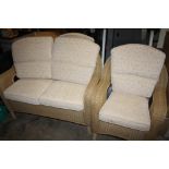 A WICKER CONSERVATORY SUITE COMPRISING OF A TWO SEATER AND A PAIR OF ARM CHAIRS (3)