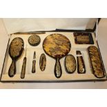 AN ORIENTAL STYLE CASED TORTOISE SHELL DRESSING TABLE SET