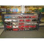 A GLASS WALL HANGING DISPLAY CASE CONTAINING DIE CAST MODEL CARS, CABINET W 106 CM, H 57 CM