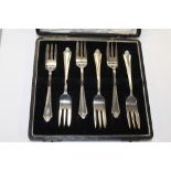 A CASED SET OF SIX HALLMARKED SILVER THREE PRONG FORKS APPROX WEIGHT - 106G