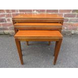 A RETRO NEST OF THREE TABLES - LARGEST W 53 CM