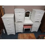 A MODERN WHITE BEDROOM DRESSING TABLE, TRIPLE MIRROR, STOOL, TALL CHEST AND TWO BEDSIDE CHESTS (6)