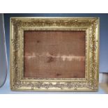 AN 18TH CENTURY DECORATIVE GILT FRAME, frame W 8 cm, rebate 57 x 39 cm