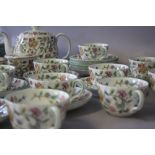 A COLLECTION OF MINTON 'HADDON HALL' PATTERN TEAWARE, comprising 12 tea cups, 12 saucers, 1 lidded