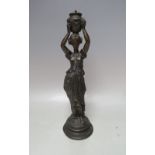 A VINTAGE BRONZE BAR GAS LIGHTER, in the form of a young woman in classical dress carrying an urn, H
