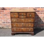 A 19TH CENTURY OAK AND WALNUT CHEST OF DRAWERS, with an unusual arrangement of four smaller