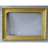 A 19TH CENTURY DECORATIVE GOLD FRAME, with arched top integral slip, some restoration, frame W 8 cm,