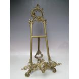 A TWENTIETH CENTURY DECORATIVE BRASS TABLE TOP EASEL, H 53 cm