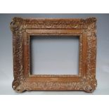 A LATE 18TH / EARLY 19TH CENTURY DECORATIVE CARVED WOODEN FRAME, some damages, frame W 9 cm,