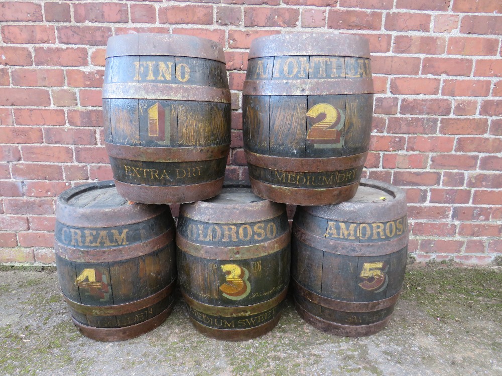 A SET OF FIVE VINTAGE COOPERED WORTHINGTON BEER BARRELS WITH LATER HANDPAINTED NUMBERS AND