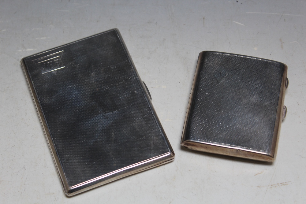 A TALL HALLMARKED SILVER CIGARETTE CASE, H 12.5 cm together with a shorter curved example, approx