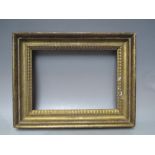 A LATE 18TH / EARLY 19TH CENTURY GOLD FRAME, with decorative design to inner edge, frame W 5.5 cm,