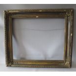 A 19TH CENTURY DECORATIVE GOLD FRAME WITH CORNER EMBELLISHMENTS, frame W 10 cm, rebate 56 x 69 cm