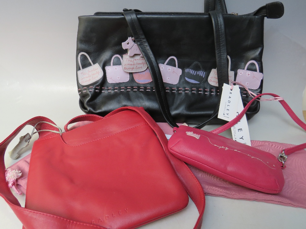 A RADLEY LEATHER CLASSIC CROSS BODY BAG, together with a black 'handbag' design bag, and a small '