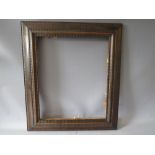 A 19TH CENTURY DUTCH DECORATIVE WOODEN FRAME, frame W 9.5 cm, rebate 48 x 57 cm