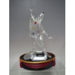 A SWAROVSKI CRYSTAL SCS 1999 MASQUERADE PIERROT FIGURE, with box, glass name plaque and stand