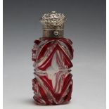 A OVERLAY GLASS SCENT BOTTLE, with push button opening chased lid, H 9 cm