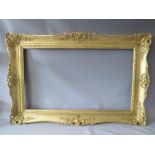 A LATE 20TH / EARLY 21ST CENTURY GOLD SWEPT FRAME, frame W 11 cm, rebate 95 x 55 cm