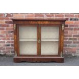 A MID VICTORIAN WALNUT AND INLAID TWO DOOR CABINET, with gilt metal mounts, H 105 m, W 123 cm, D