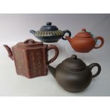 A SELECTION OF ORIENTAL TERRACOTTA TEAPOTS ETC., to include an hexagonal example with relief