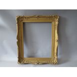 A 19TH CENTURY GOLD SWEPT FRAME WITH RESTORATION, frame W 8 cm, rebate 52 x 42 cm