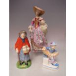 A FRANKLIN MINT V & A MUSEUM FIGURINE, depicting a lady in traditional costume reading a book, H