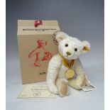 A STEIFF YEAR BEAR 'THE MILLENNIUM BEAR' 654701, button in ear with yellow tag, serial no 17509,