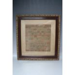 A 19TH CENTURY FRAMED AND GLAZED SAMPLER, by ANN WILDING Aged 8 and dated 1836, 30 x 28 cm