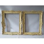 A PAIR OF 20TH CENTURY DECORATIVE GILT SWEPT FRAMES, frame W 7 cm, rebate 51 x 39 cm