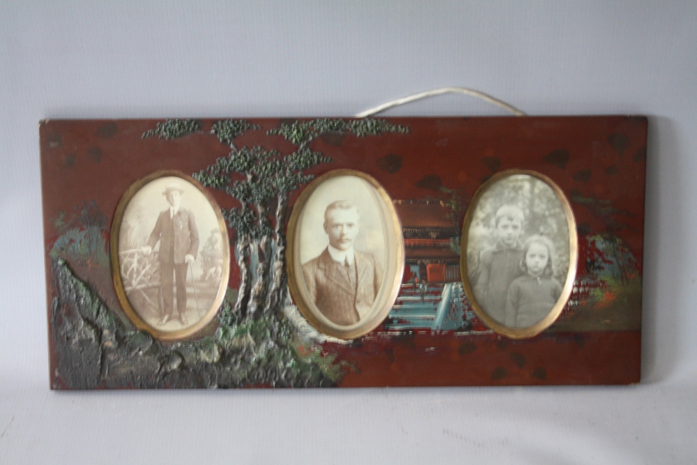 A VINTAGE PAINTED DECORATIVE LACQUERED FRAME, with part decorated in relief and three oval