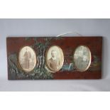 A VINTAGE PAINTED DECORATIVE LACQUERED FRAME, with part decorated in relief and three oval