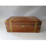 A MAHOGANY BRASS BANDED WRITING BOX, the hinged lid opening to reveal a fitted interior leather