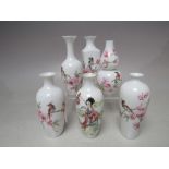 A COLLECTION OF SIX MINIATURE ORIENTAL FINE PORCELAIN VASES, white ground with flowering prunus,