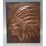 A TWENTIETH CENTURY EMBOSSED COPPER PLAQUE of a native American Indian with headdress, 25 x 20 cm