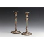 A PAIR OF HALLMARKED SILVER CANDLESTICKS - SHEFFIELD 1909, having filled bases, H 24.5 cm