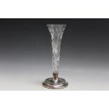 A HALLMARKED SILVER AND CUT GLASS SPECIMEN VASE - BIRMINGHAM 1992, having a filled base, H 21 cm