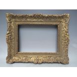 A LATE 18TH / EARLY 19TH CENTURY CARVED WOODEN GOLD DECORATIVE FRAME, frame W 8 cm, rebate 34 x 24