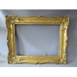 A 19TH CENTURY GOLD SWEPT FRAME, with some restorations, frame W 12 cm, rebate 74 x 55 cm