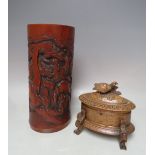 A LARGE ORIENTAL CARVED BAMBOO BRUSH POT A/F, H 28 cm, together with a 20th century carved wooden