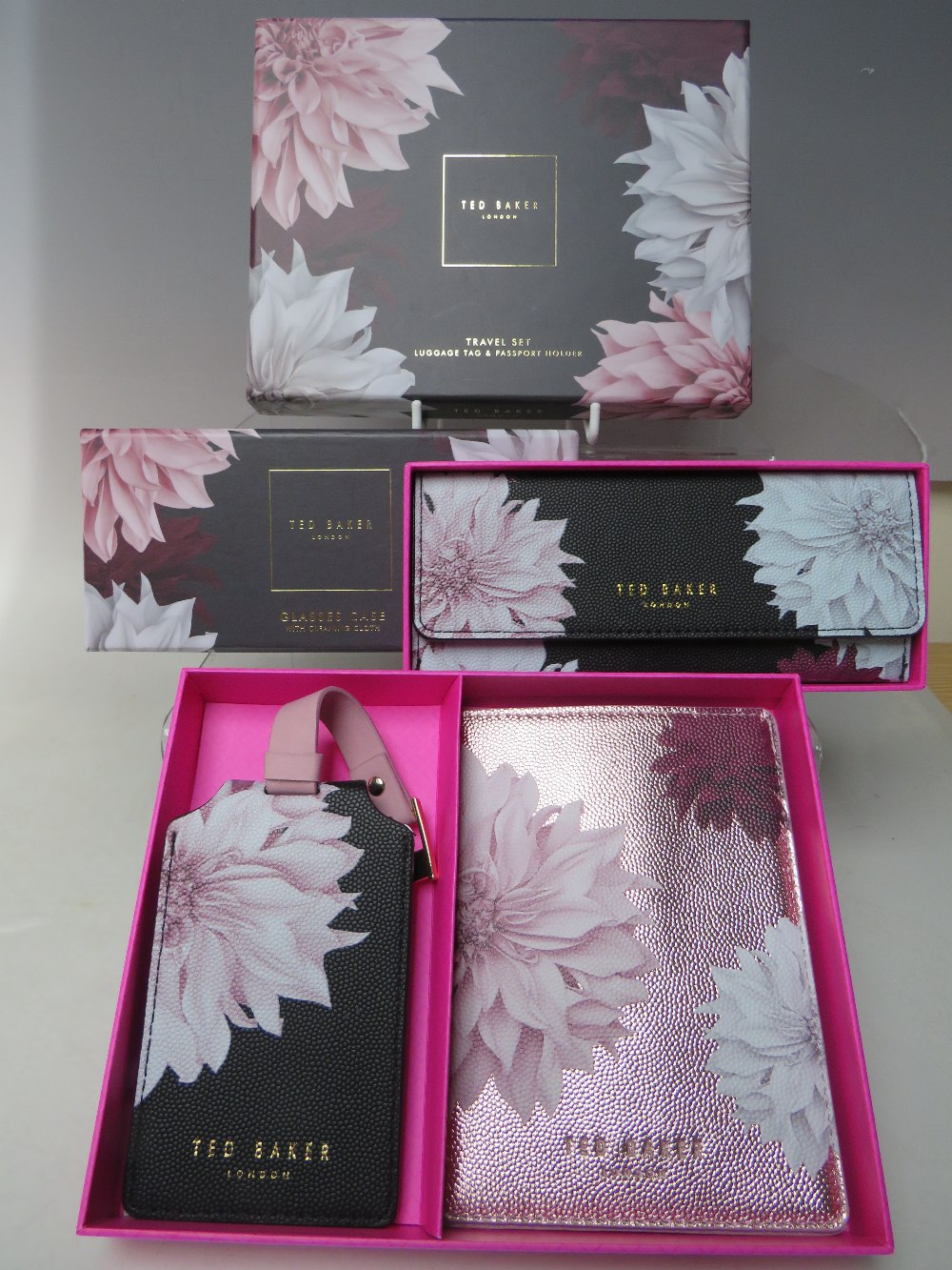 A NEW AND BOXED TED BAKER TRAVEL SET, comprising a luggage tag and passport holder, together with