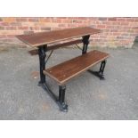 A CAST IRON VICTORIAN SCHOOL BENCH BY FISHER OF WOLVERHAMPTON, with cast iron frame and later oak