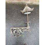 A CAST IRON EXTERIOR / COURTYARD LANTERN ON WALL BRACKET, with copper hood, approx. overall H 98 cm,