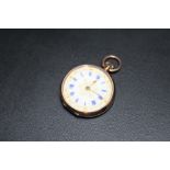 A HALLMARKED 9 CARAT GOLD OPEN FACED MANUAL WIND FOB WATCH, with gold inlay enamel dial and blue