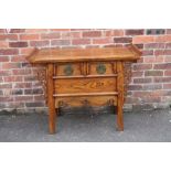AN ANTIQUE CHINESE ELM TWO DRAWER COFFER / ALTER TABLE, having a tray type rectangular top above two