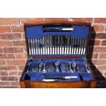 A MID TWENTIETH CENTURY OAK CASED CANTEEN OF PLATED CUTLERY, the canteen with hinged lid and