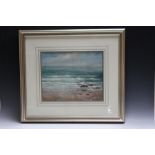 AN ATMOSPHERIC COASTAL BEACH SCENE WITH HALCYON GALLERY LABEL VERSO, indistinctly signed and dated